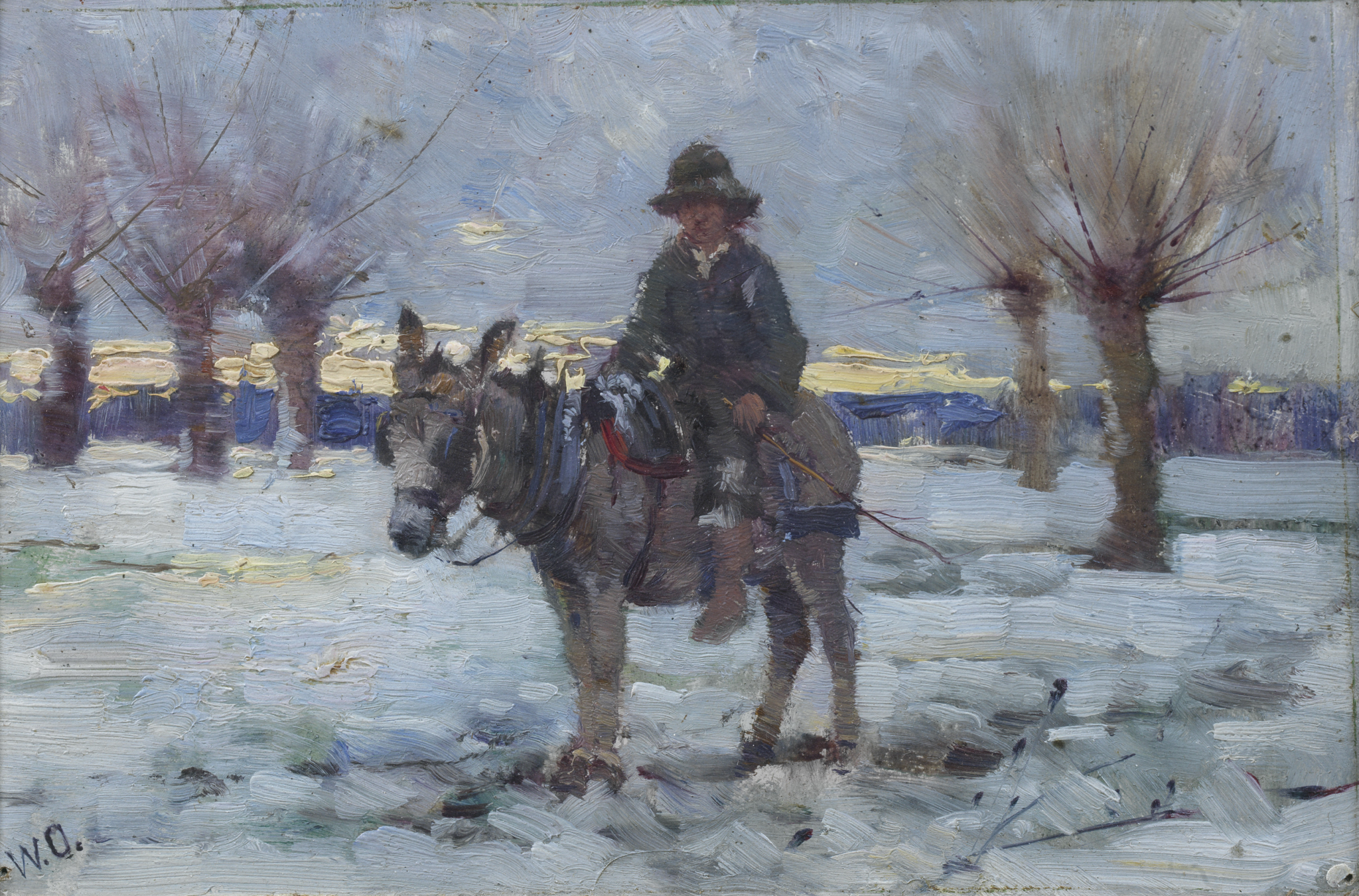 Boy on a donkey in a snowy landscape